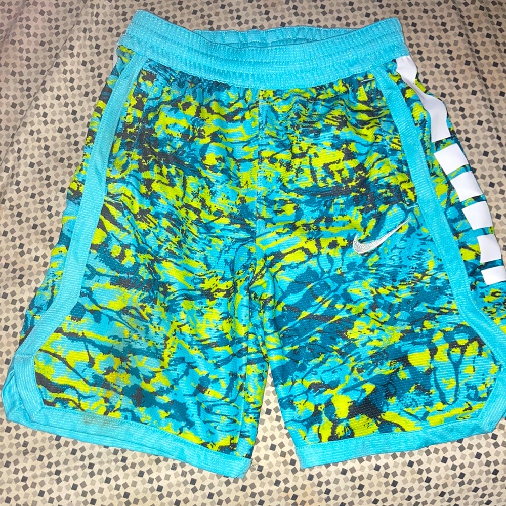 Woman’s green blue and white  Nike shorts size medium brand is DRI -FIT